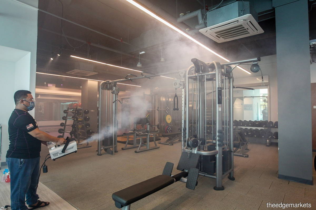 Disinfection work being carried out by a worker at a gymnasium in Putrajaya today (Sept 10). Cumulatively, the nation has reported 1.94 million Covid-19 infections to date. (Photo by Mohamad Shahril Basri/The Edge)